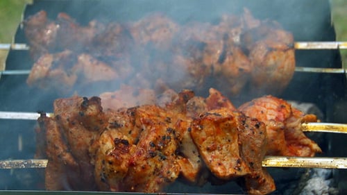 Delicious Meat Skewers Grilling on Barbecue