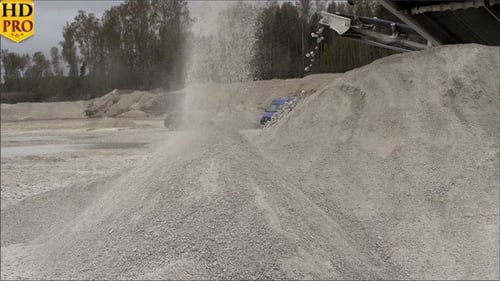 Industrial Conveyor Belt Transporting Rocks and Raw Materials