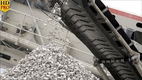 Conveyor Belt Deposits Rocks on Pile