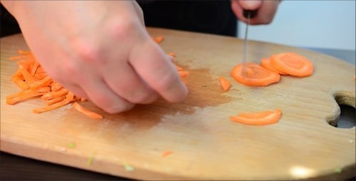 Slicing Fresh Carrots for Cooking Preparation