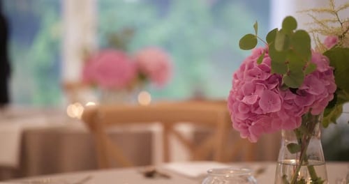 Indoor Wedding Reception with Pink Flowers