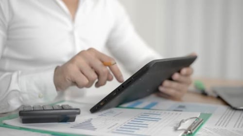 Businessman Using Tablet PC in Office
