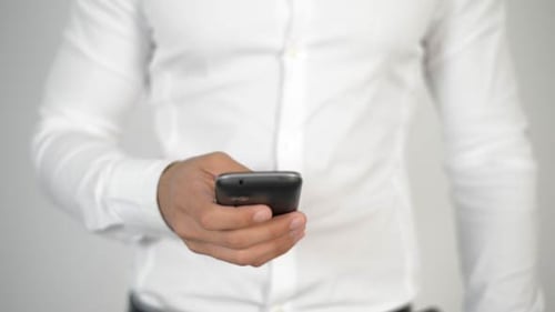 Hands Holding a Smartphone