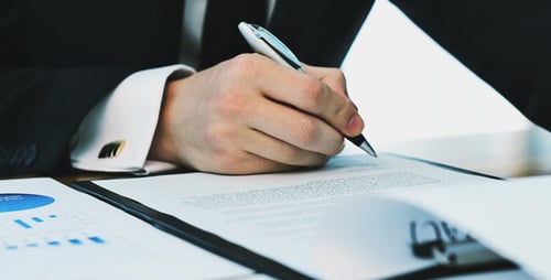 Adult Signing Documents and Reviewing Data