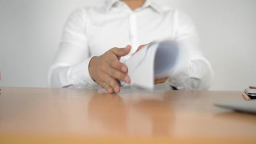 Gathering Documents on Office Table