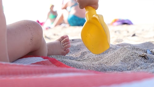 Baby Playing With Sea Sand