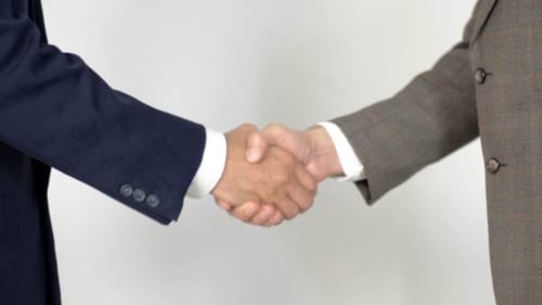 Business Handshake Close Up Against White Background