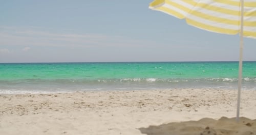 Beach Umbrella On a Sunny Tropical Beach
