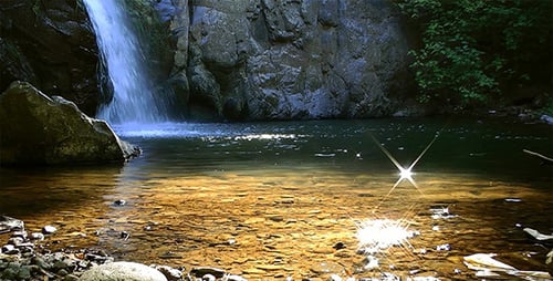 Beautiful Waterfall Cascading into Forest Pool