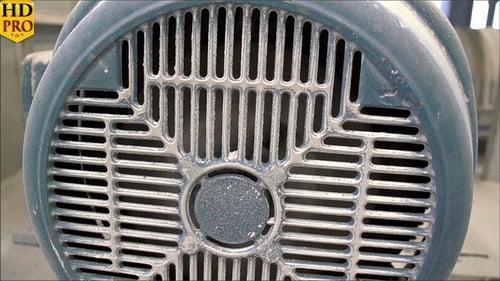 Close Up of Electric Motor Grill Covered in Powder