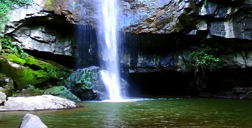 Scenic Waterfall Flowing Into Natural Pool