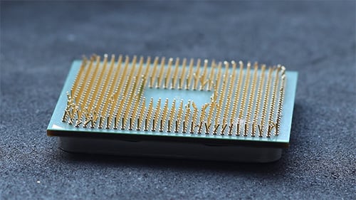 Damaged Computer CPU Chip with Bent Pins