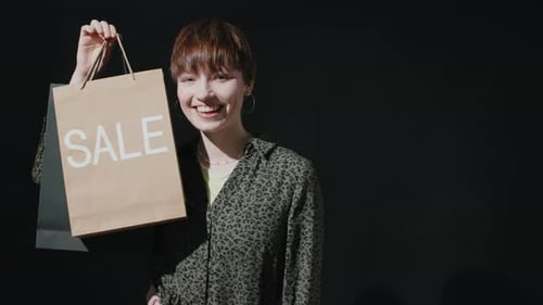 Woman with Shopping Bags Smiling