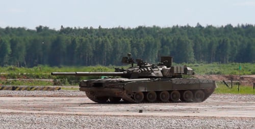 Two Tanks Sit on Concrete on Sunny Day