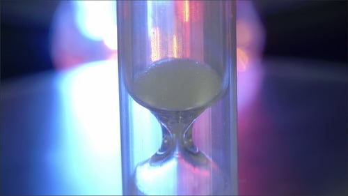 A Small Hourglass Dropping the Sand