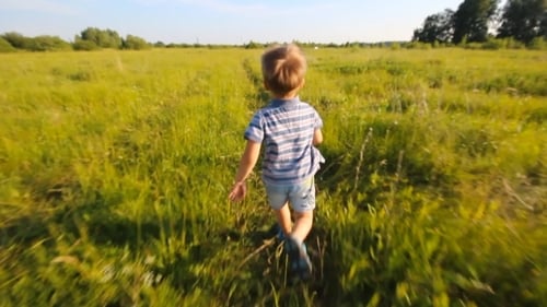 Boy Running In a Park Or Garden