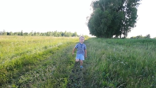 Boy Running In a Park Or Garden