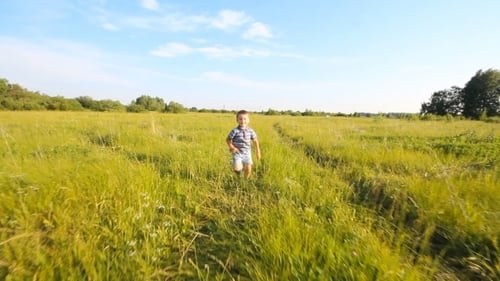 Boy Running In a Park Or Garden