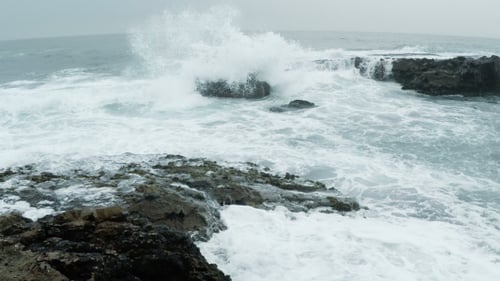 Cold Ocean Surf on the Rocky Shore