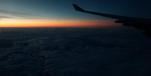 Clouds Passing By Seen Through Airplane Window