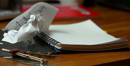 People Tearing Paper Into Notepad