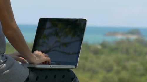 Typing On Laptop In Holiday