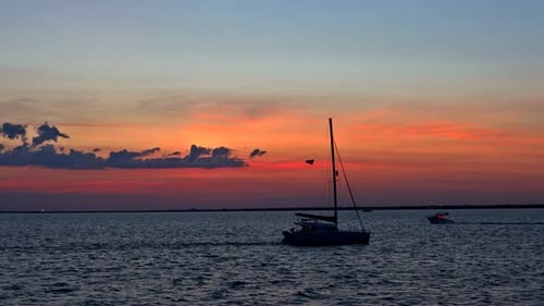 Sailboat Silhouette at Colorful Sunset on the Ocean