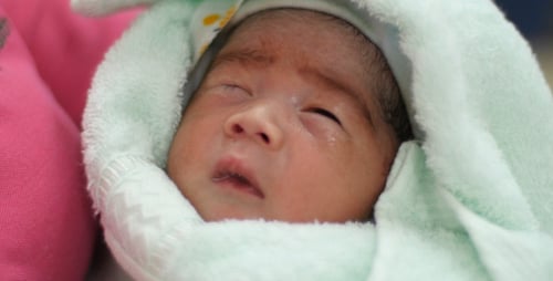 Close-up of a Newborn Baby Sleeping Peacefully