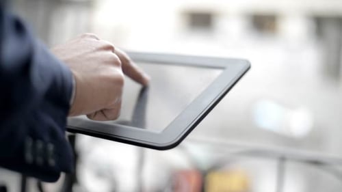 Close Up of Tablet Use in Urban Setting