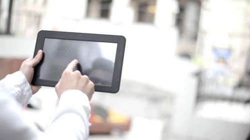 Young Man Using Tablet PC