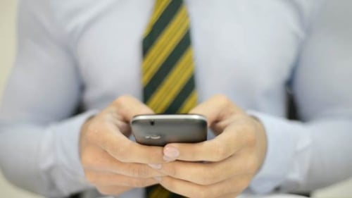 Using Cell Phone Businessman