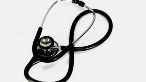 Black Stethoscope Rotating on White Background