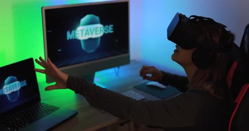 Woman Exploring Metaverse with VR Headset in Dark Room