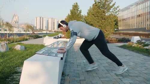 Man Doing Push-Ups in Urban Park