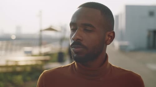 Portrait of Cheerful African American Man on Street