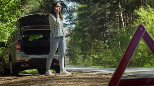 Woman Calling for Assistance Because of Broken Car