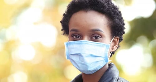 Closeup Face of Afro American Woman Girl Wearing Medical Mask Protection Against Coronavirus Covid