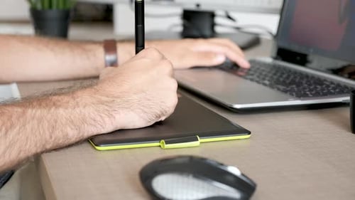 Person Using Graphics Tablet and Stylus Close Up