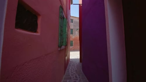 Dolly Shot Through Vibrant Colored Urban Alleyway