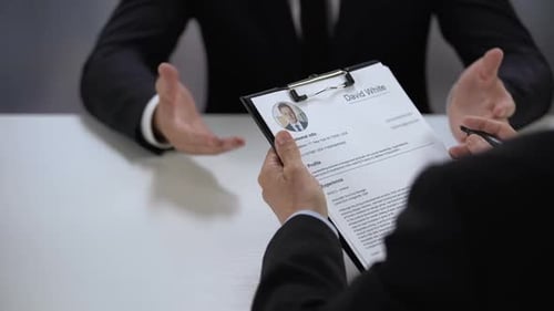 Hiring Manager Marking Applicant Name in Resume During Job Interview, Success