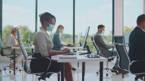 Office Workers Wearing Face Masks at Desks