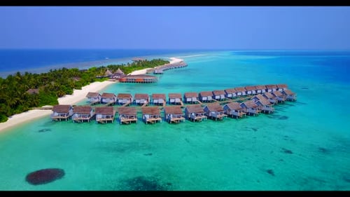 Aerial flying over travel of tropical island beach break by blue water with bright sand background o