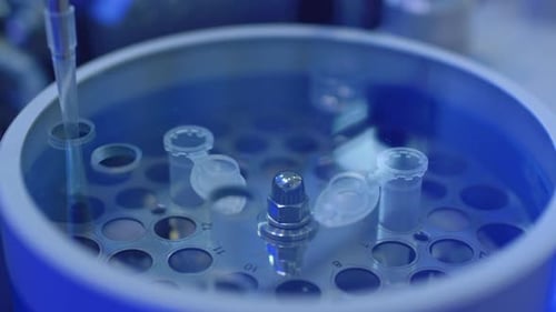 Robotic Arm Dispenses Fluid into Test Tubes