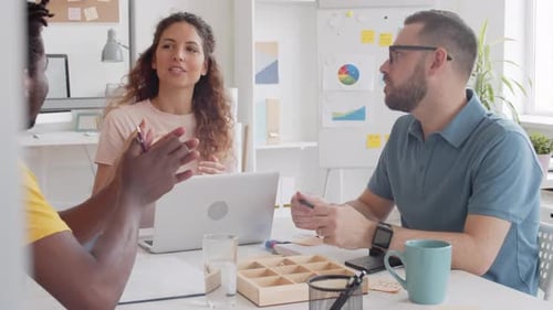 Team Discussing Business in a Modern Office