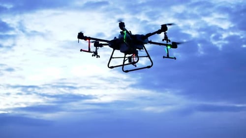 Futuristic Drone Flying at Sunrise or Sunset