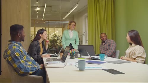 Diverse Team Meeting in Bright Modern Office