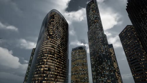 Edificios de oficinas de rascacielos de cristal con cielo oscuro