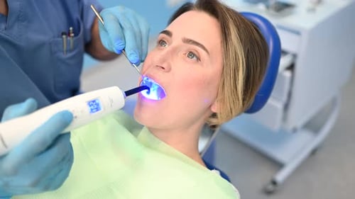Woman Undergoing Dental Work Close-Up