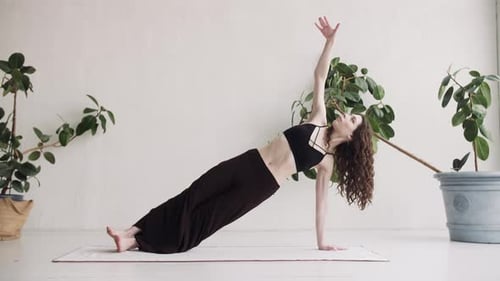 Woman Doing Side Plank Exercise at Home
