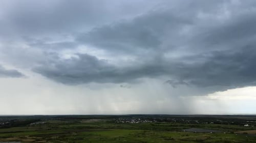 Landscape of Dark Clouds Forming on Stormy Sky During Thunderstorm Over Rural Area